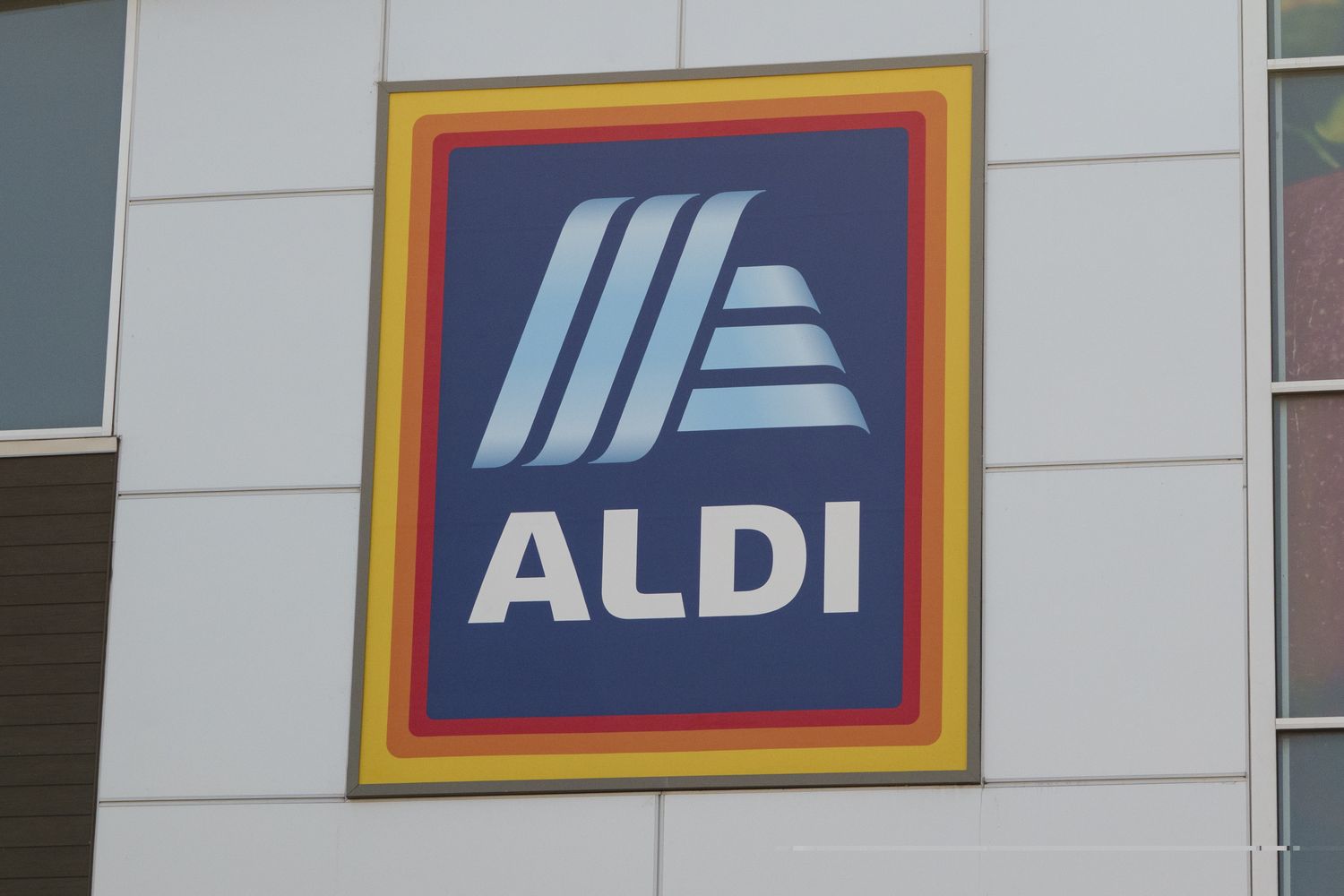 A sign displaying the Aldi logo on a building