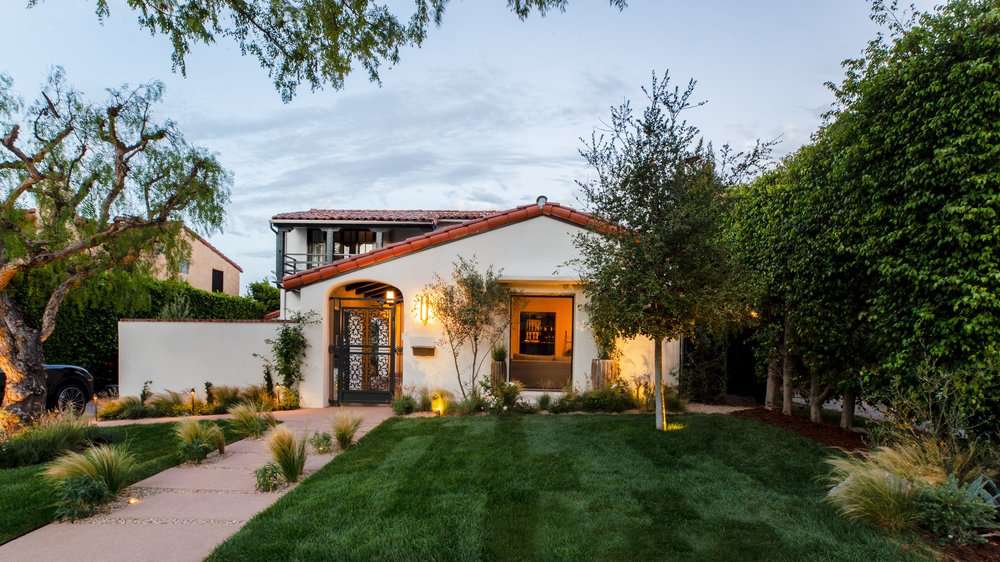Solar lights, large paved path and grasses landscaping