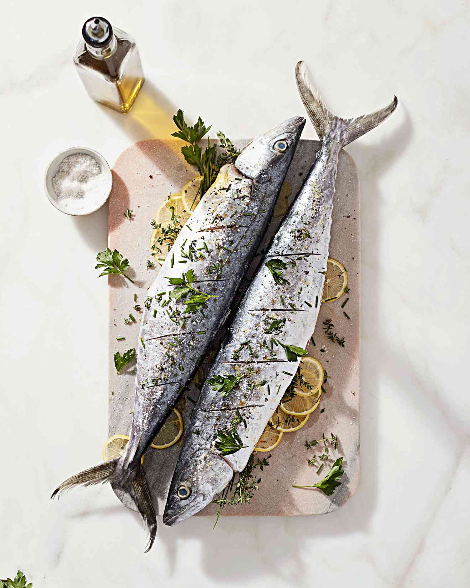 whole roasted mackerel on cutting board