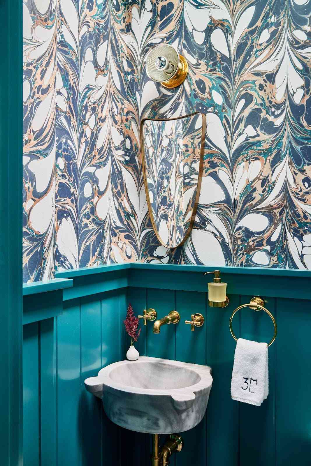 A bathroom with marble wallpaper