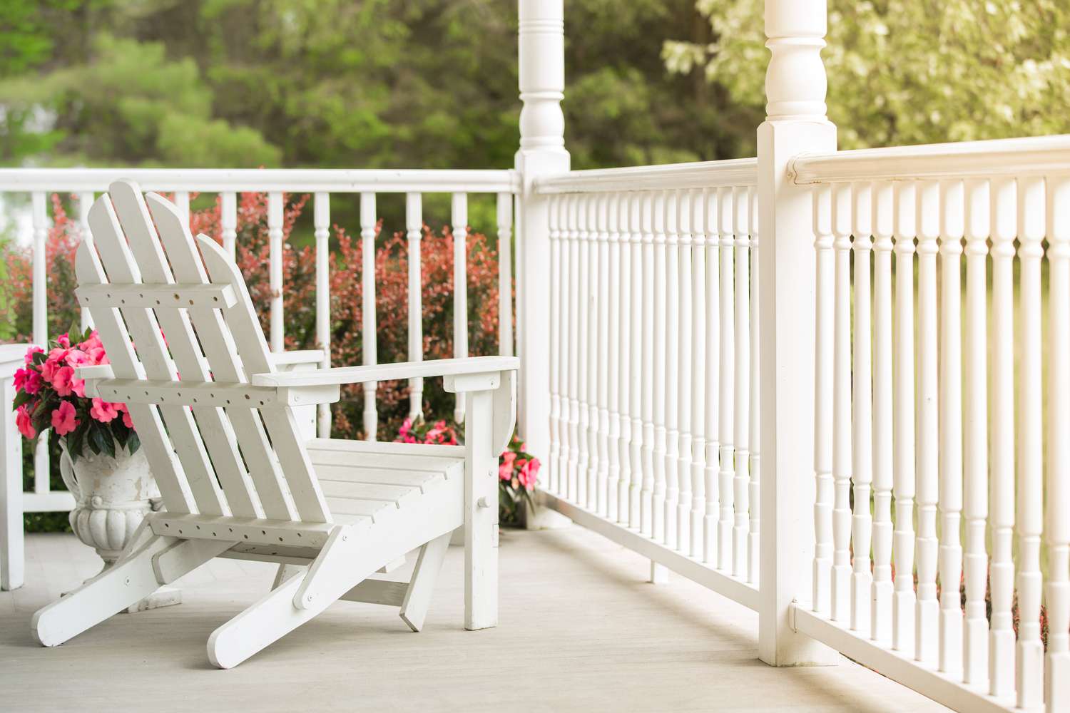 Cleaned front porch with chair and flowers