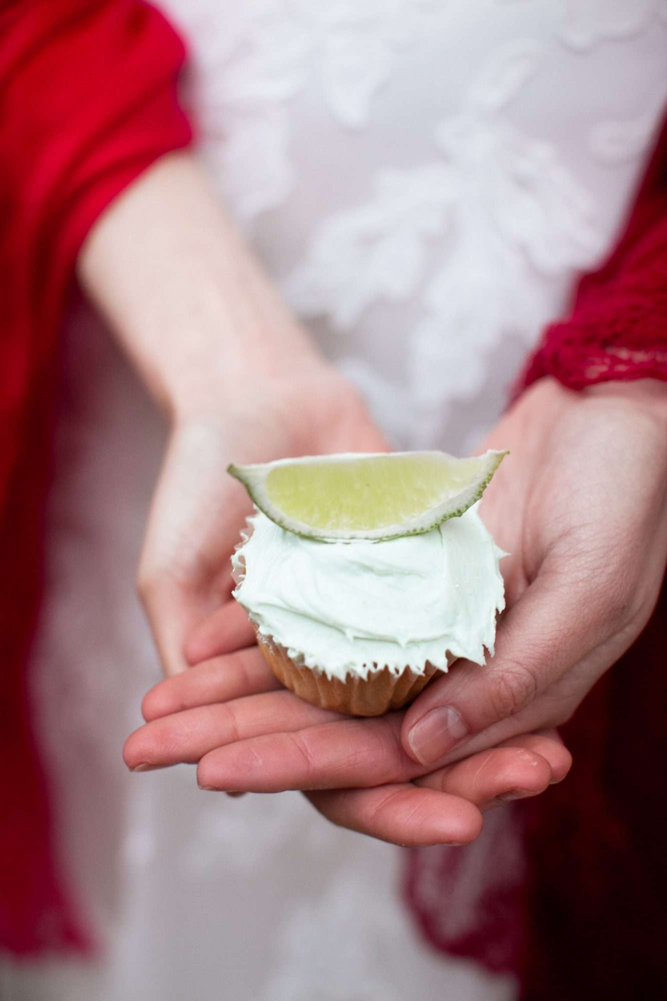 green frosted cupcake with lime on top