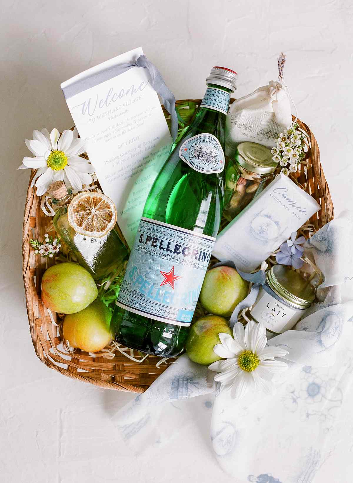citrus and cosmo themed wedding guest welcome basket
