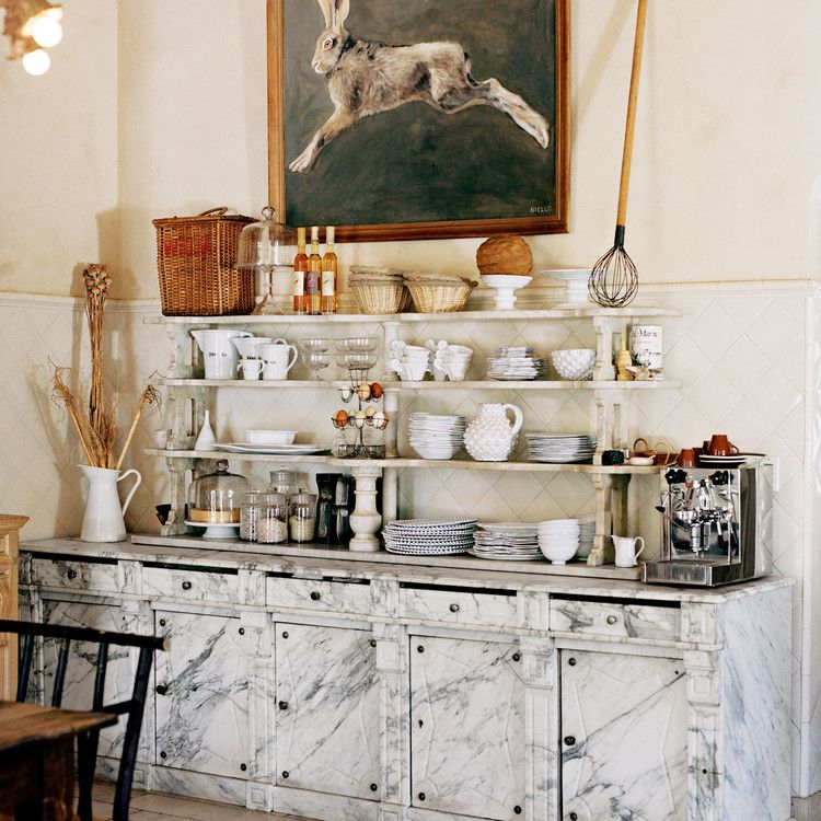 kitchen with marble cabinets open shelving rabbit painting