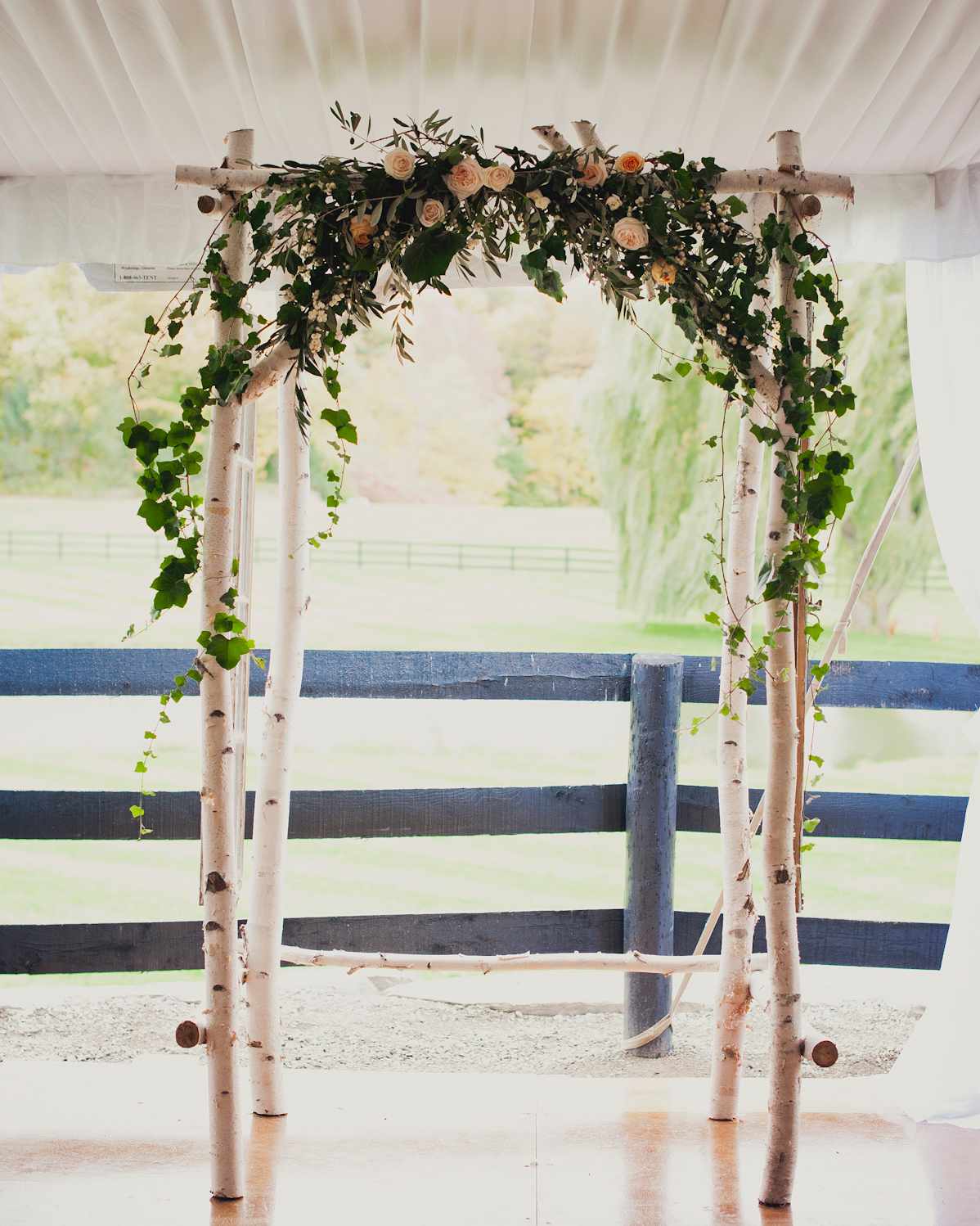 Unkempt Willow Branch Wedding Arch with Pink and Orange Flowers