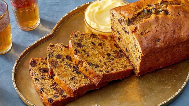 sliced fruit tea cake on golden platter