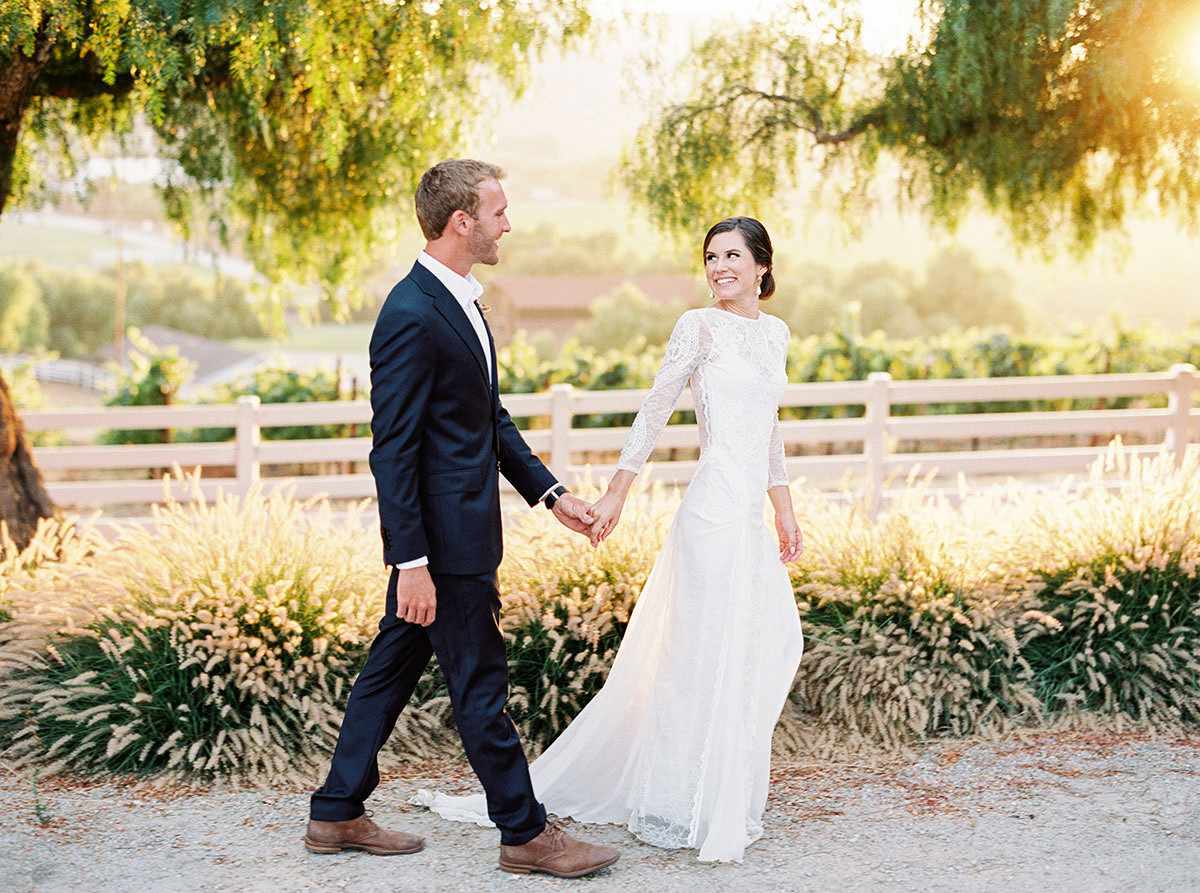 jena donny wedding couple walking holding hands