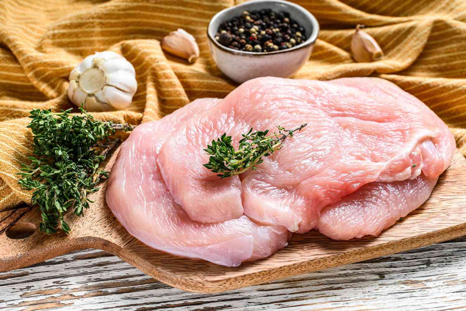 Turkey breast steaks on a chopping Board. fresh poultry meat.