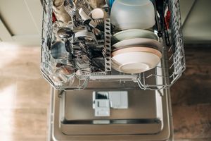 overhead view of open dishwasher full of dishes