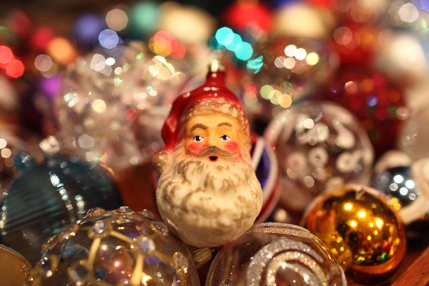 Santa Claus decoration among Christmas ornaments