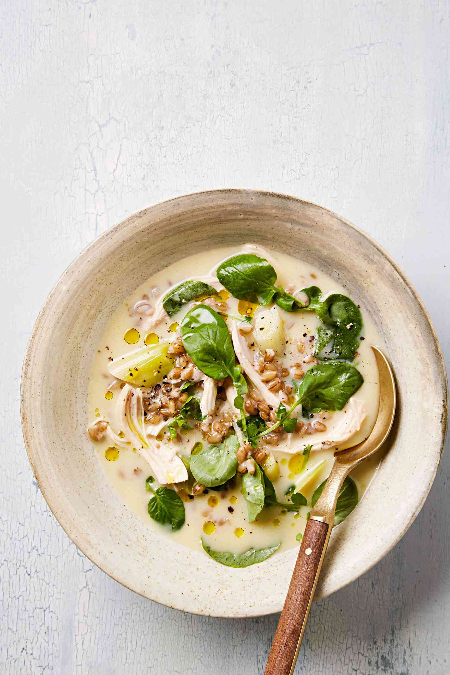 creamy lemon barley soup in bowl