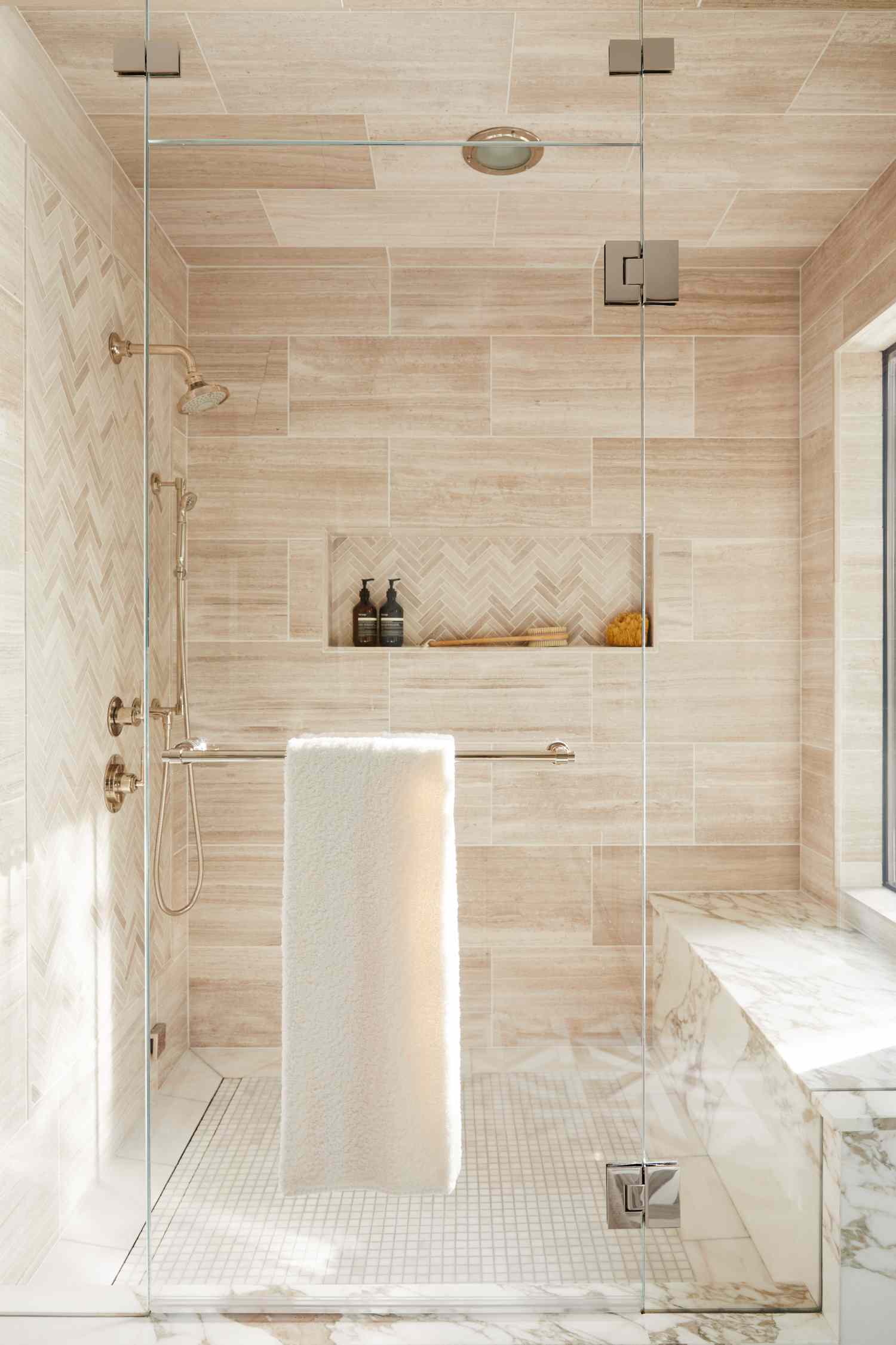 walk in shower with pale tile 