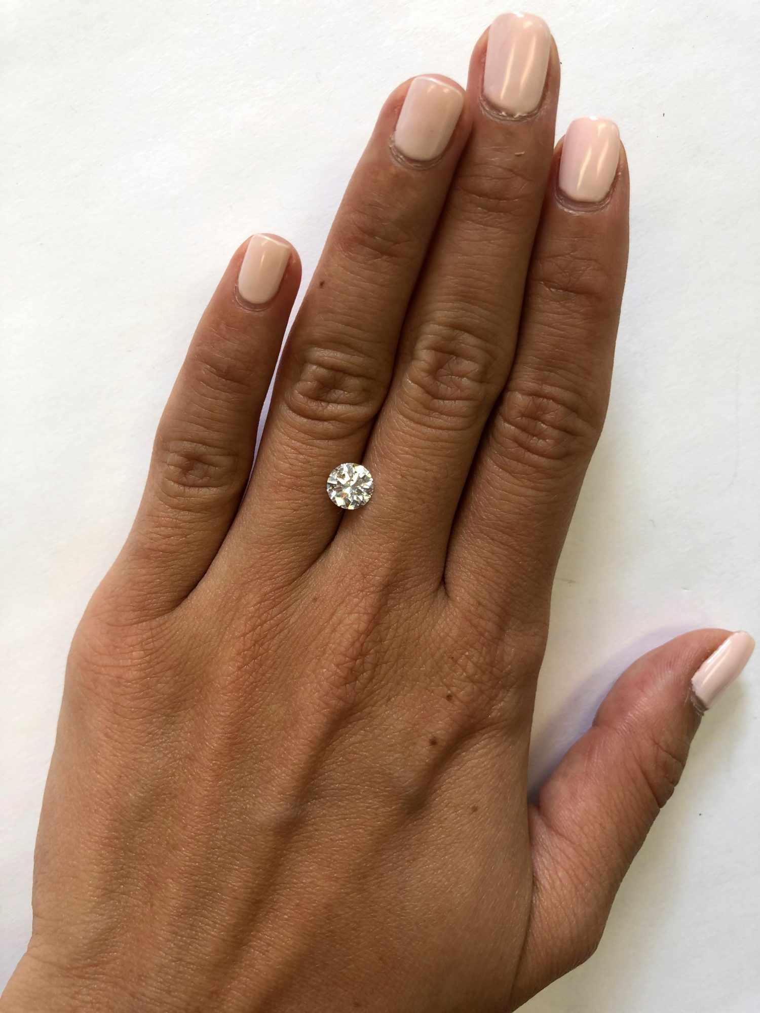 hand with one carat diamond