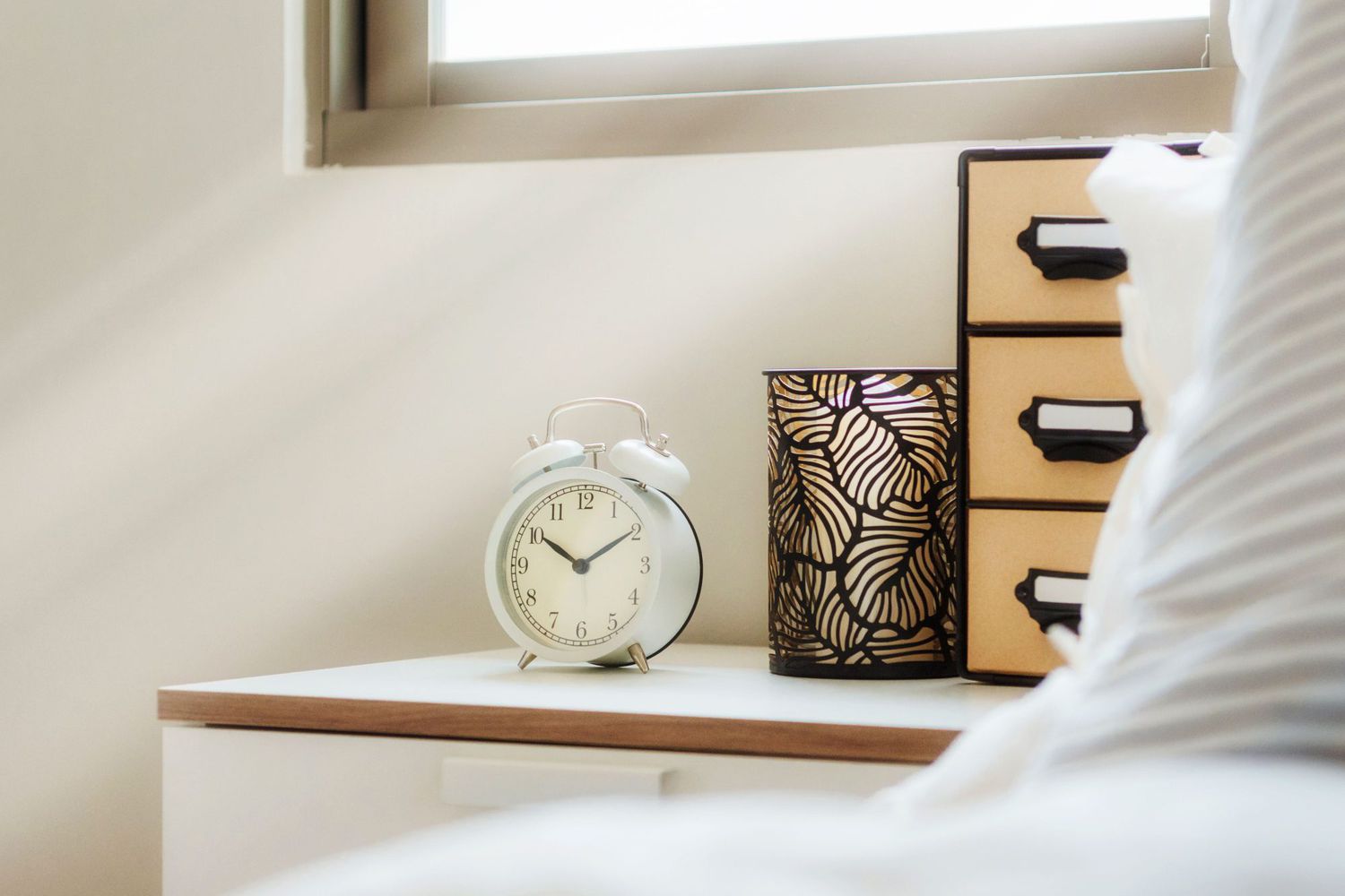 alarm clock on bedside night stand