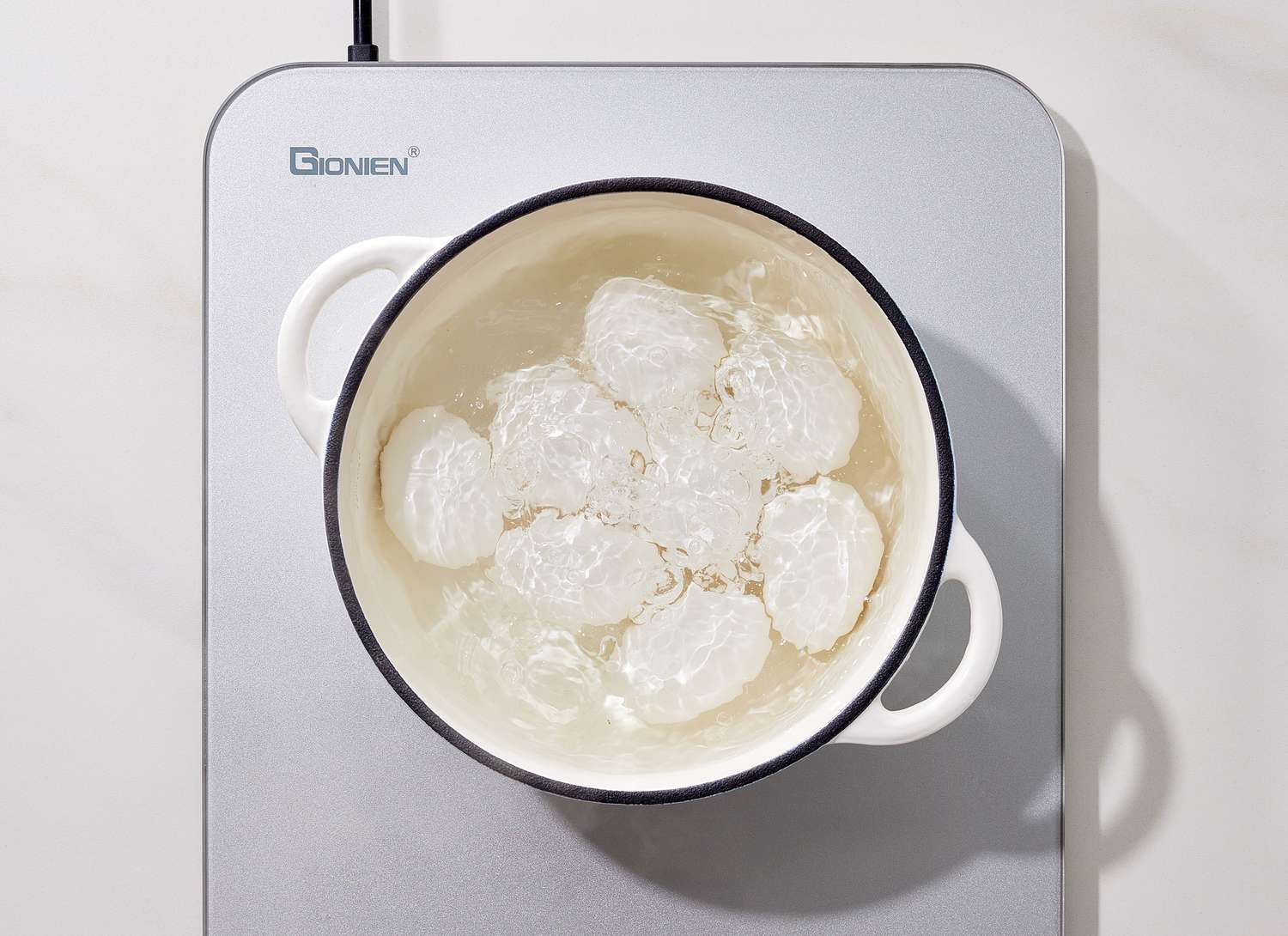 overhead view of eggs boiling