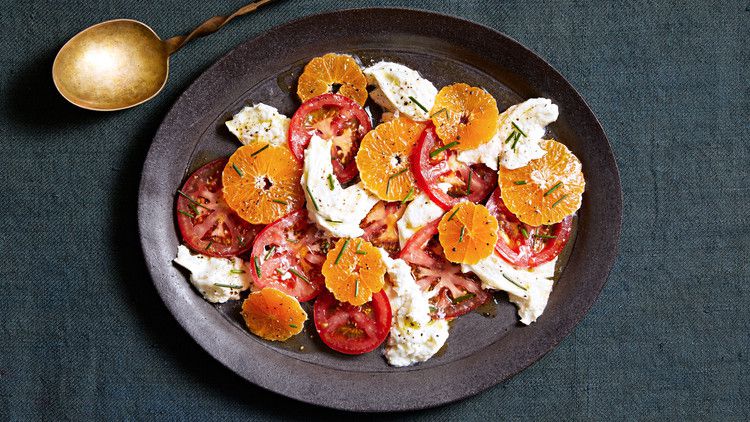 winter caprese salad topped with chives