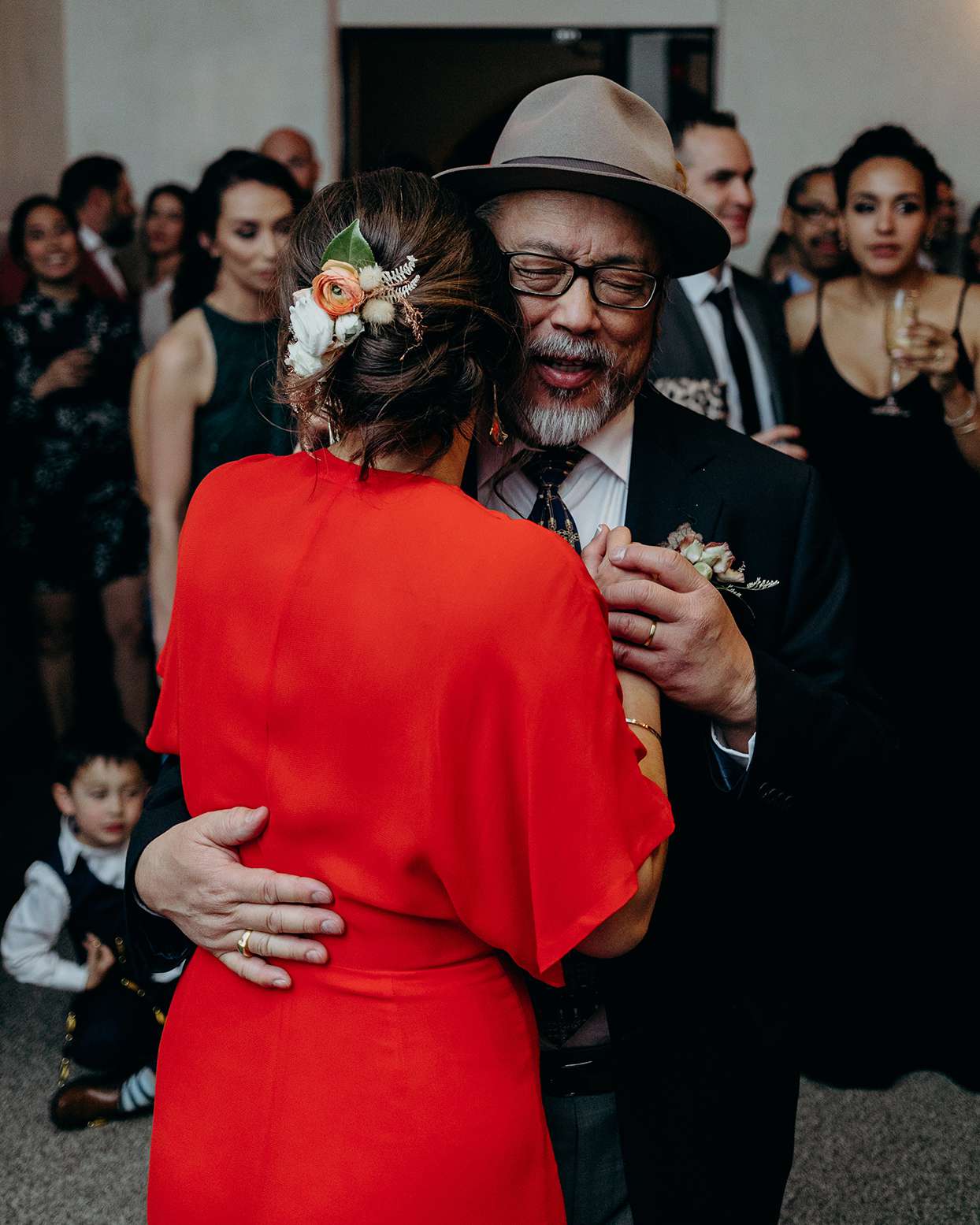reception father dancing with bride in red jumpsuit