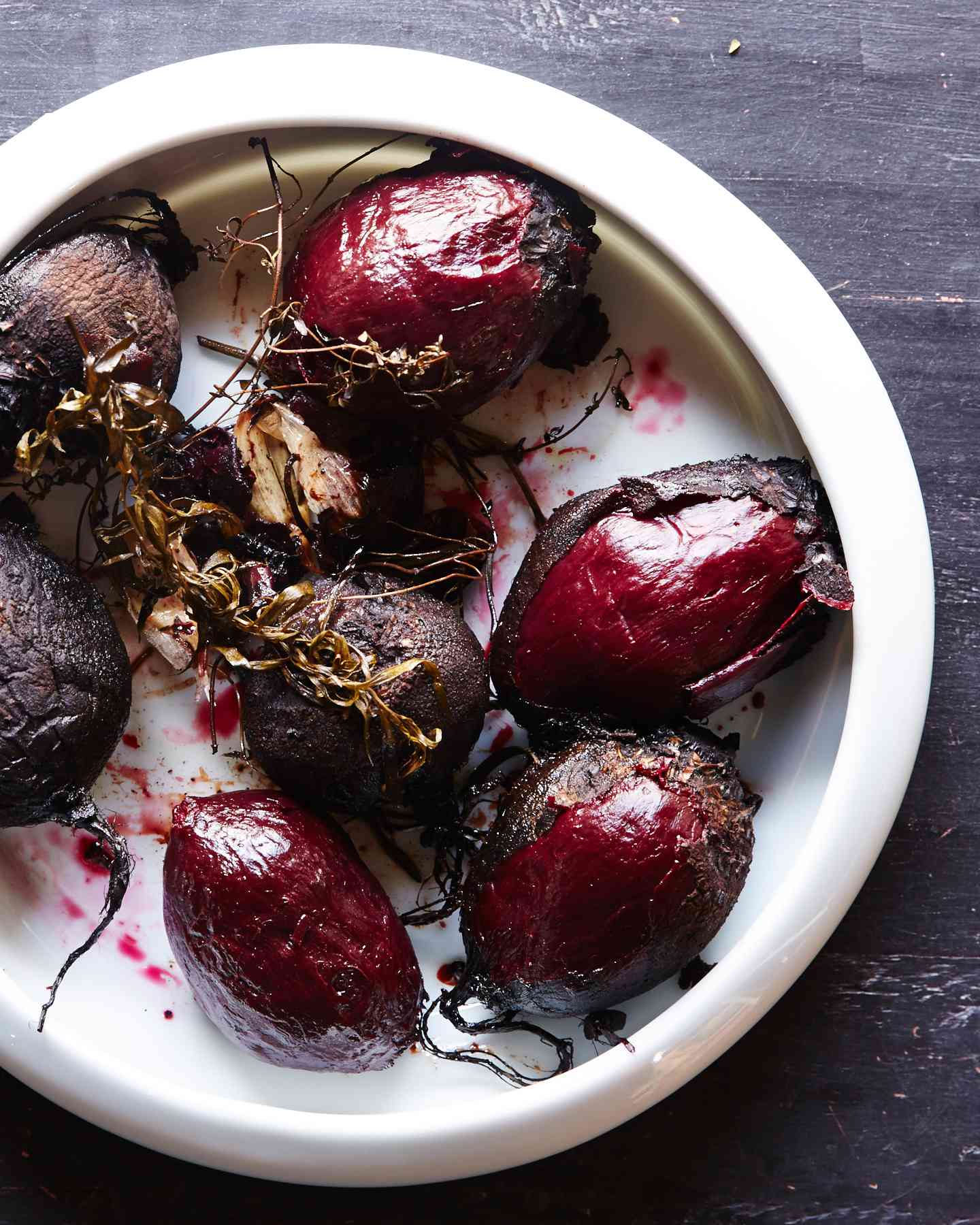 roasted beets in a dish, unpeeled