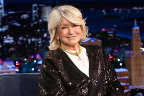 decorvow indoors seated on a talk show set with Jimmy Fallon. 