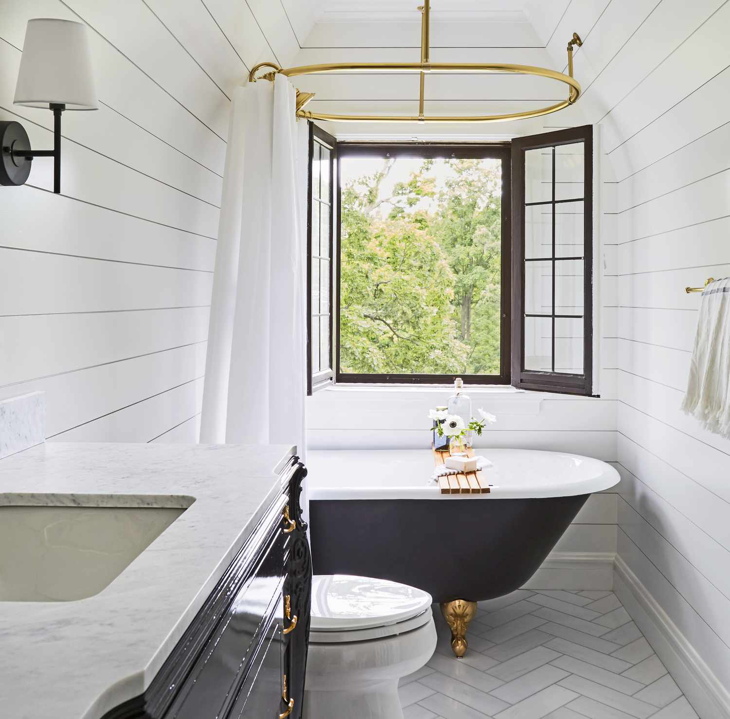 bright attic bathroom with clawfoot tub