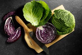 Assorted cabbage on cutting board 