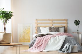Messy pink, white, and gray bedding