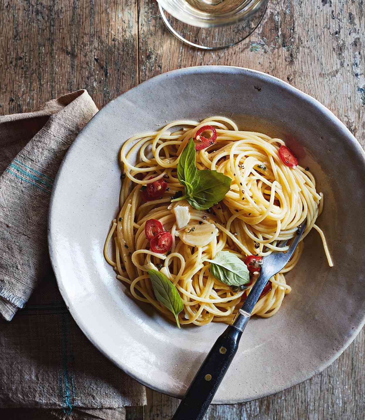 spaghetti with garlic oil and chile served on gray plate