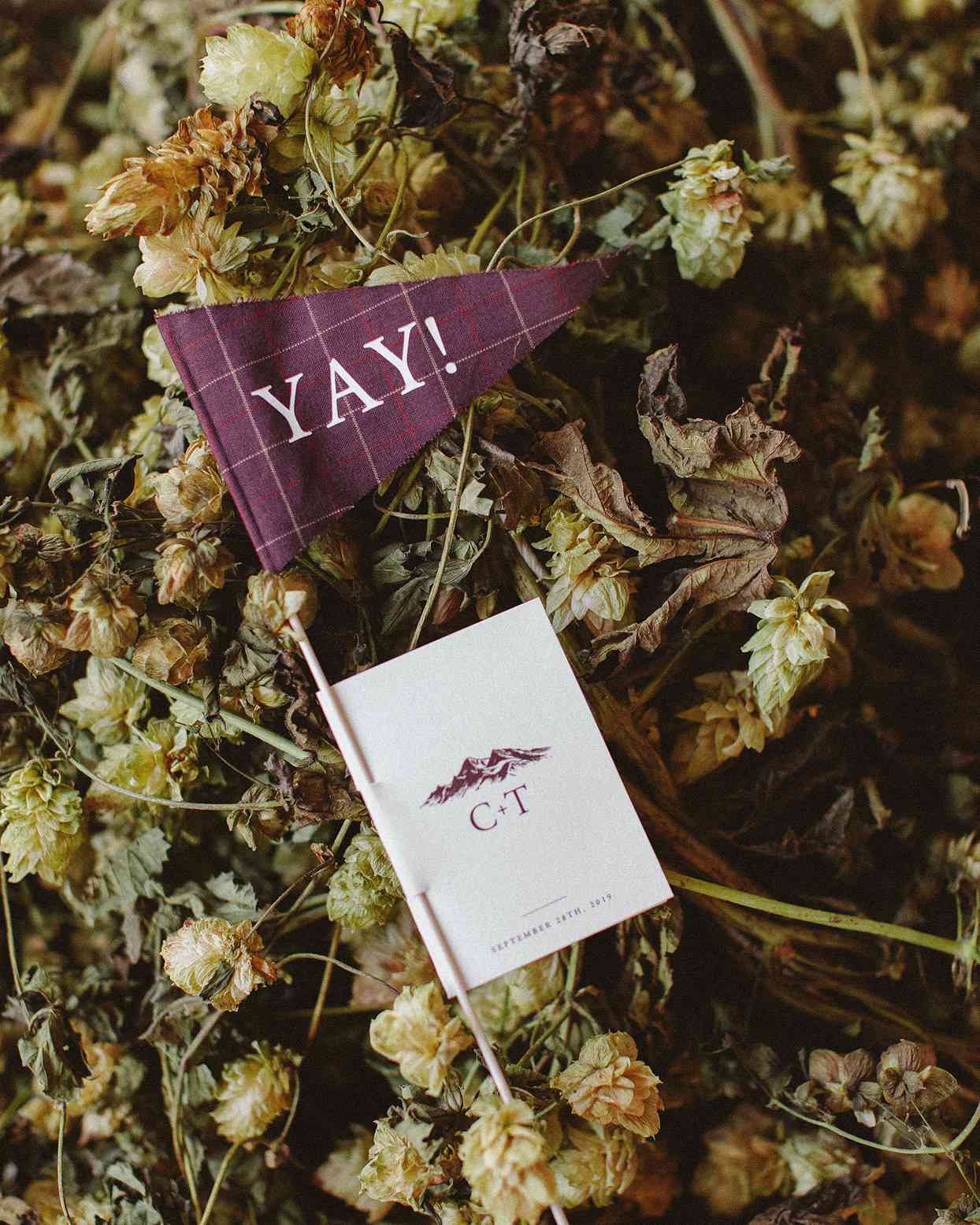 clare tim wedding ceremony programs with burgundy flag attached