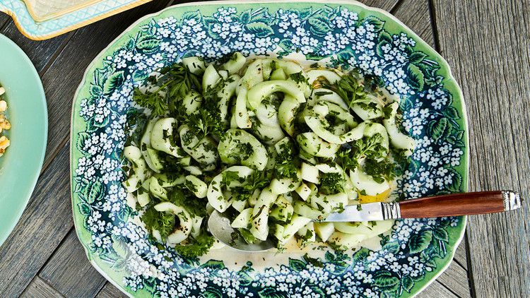 cucumber-herb salad served in floral-patterned dish