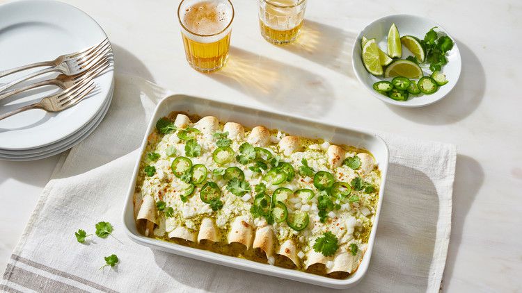 enchiladas suizas topped with jalapenos and cilantro