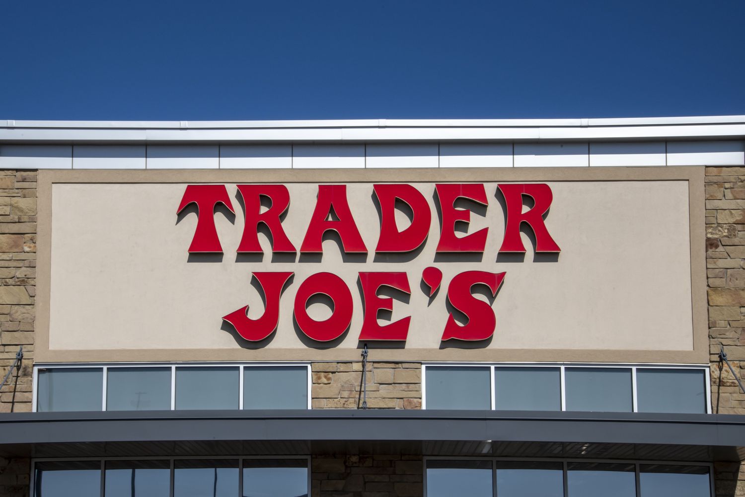 The Trader Joes logo on the exterior of a store building