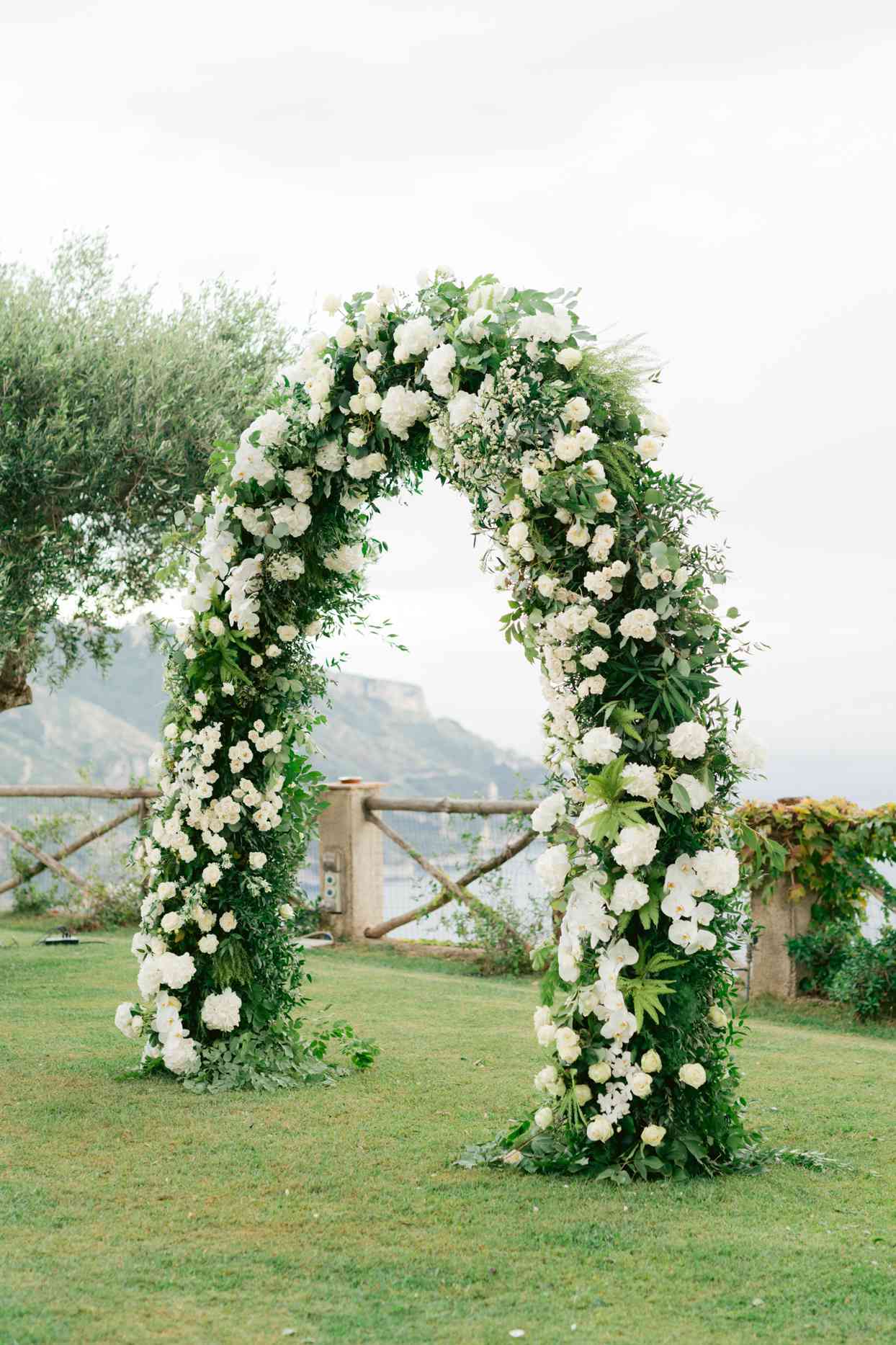 white floral wedding arch outside