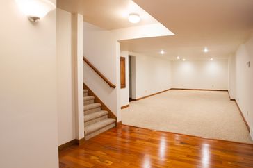 Finished basement with stairs hardwood flooring and carpeted area
