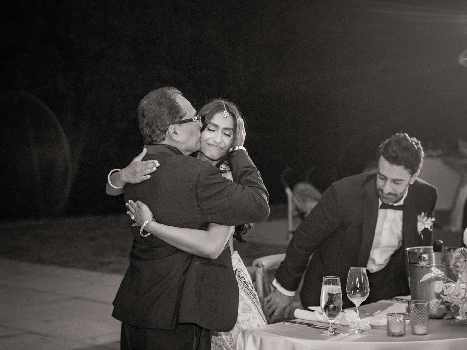 bride and dad hugging wedding reception