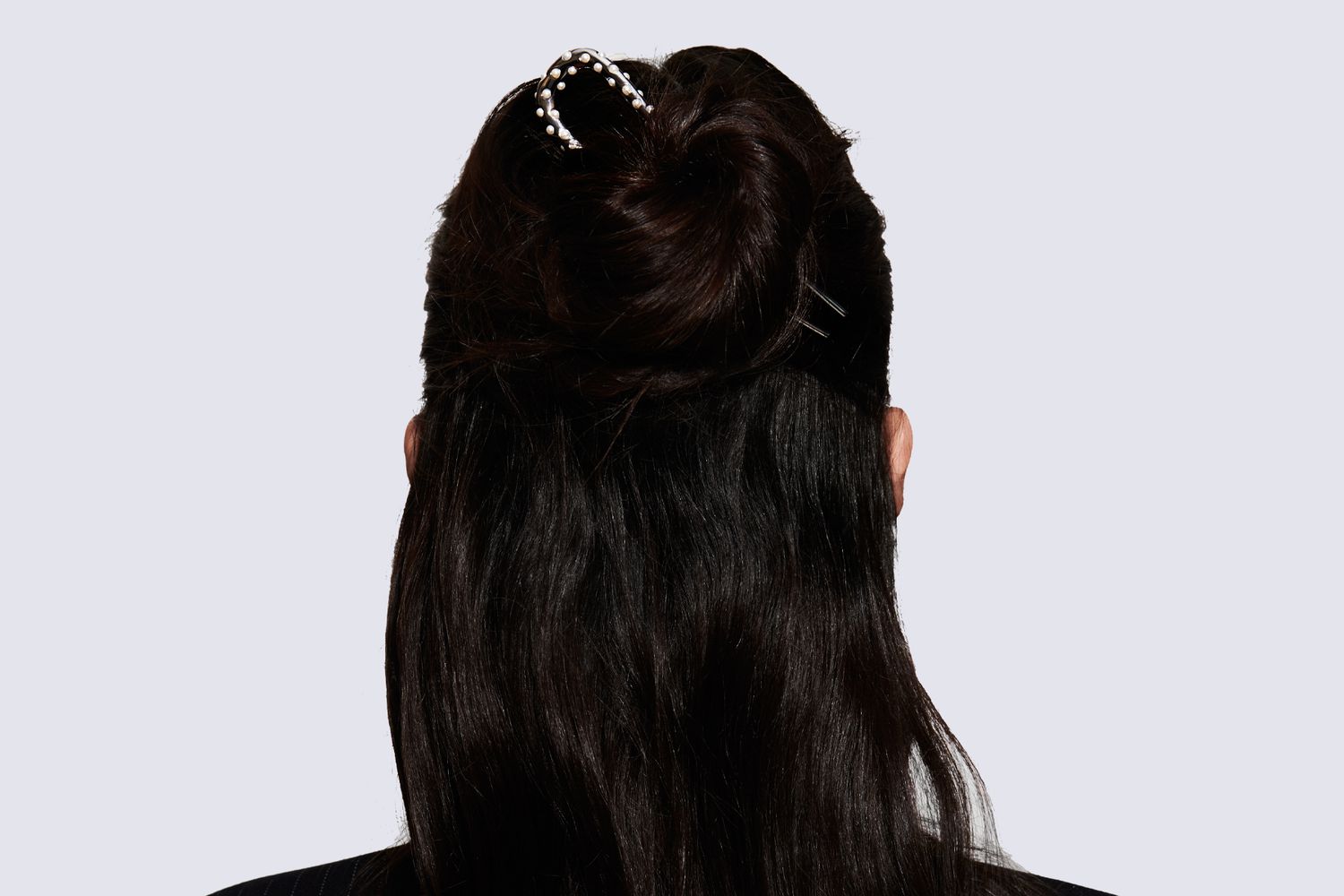 Half-up hairstyle with french pin