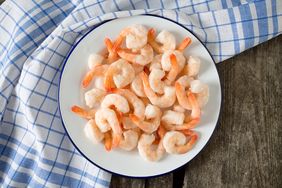 frozen shrimps on wooden surface