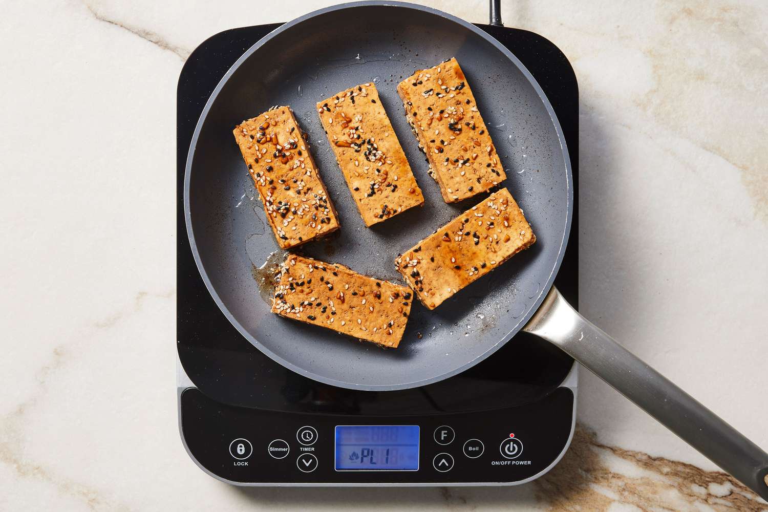 Tofu marinated in a skillet