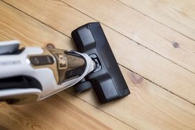 A closeup view of a vacuum cleaner on a wooden floor