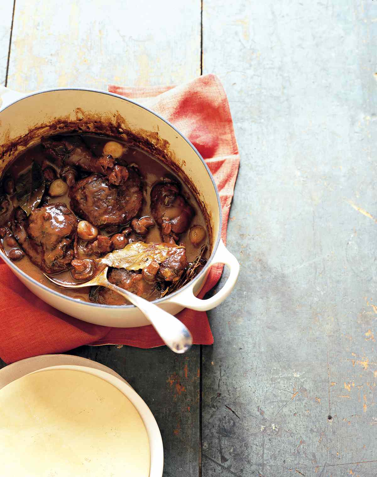 coq au vin with serving spoon
