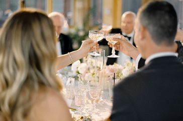 bride and groom toasting at wedding reception