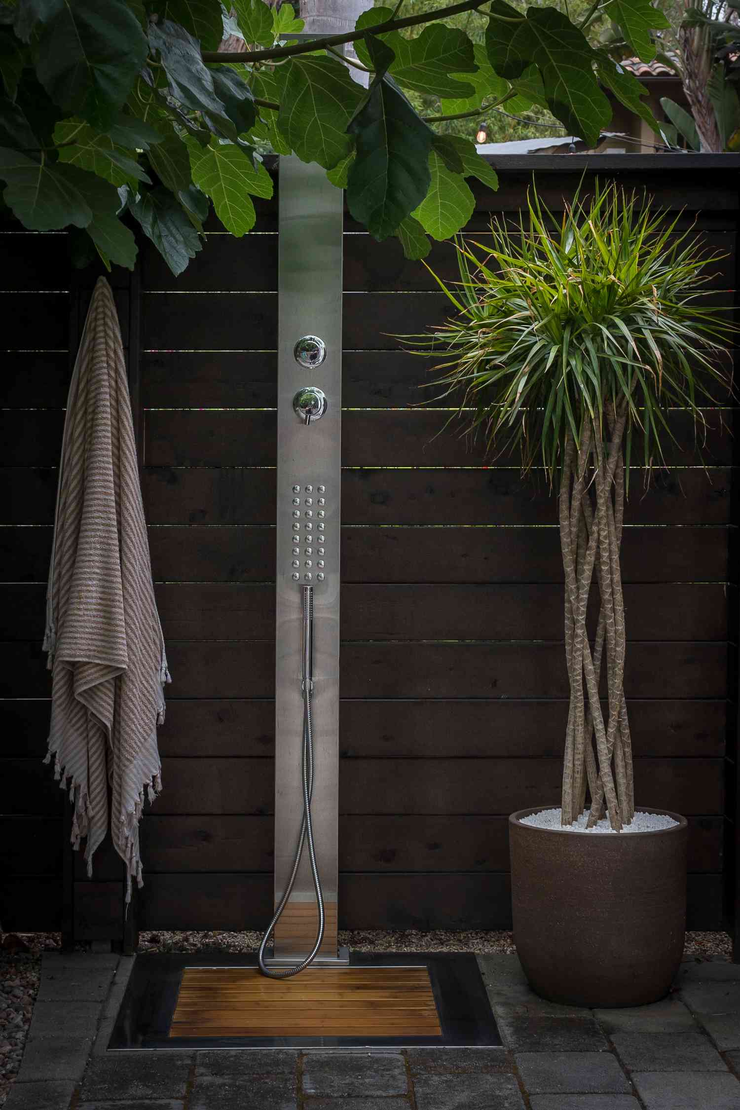Outdoor shower with a minimalist, nature-infused design