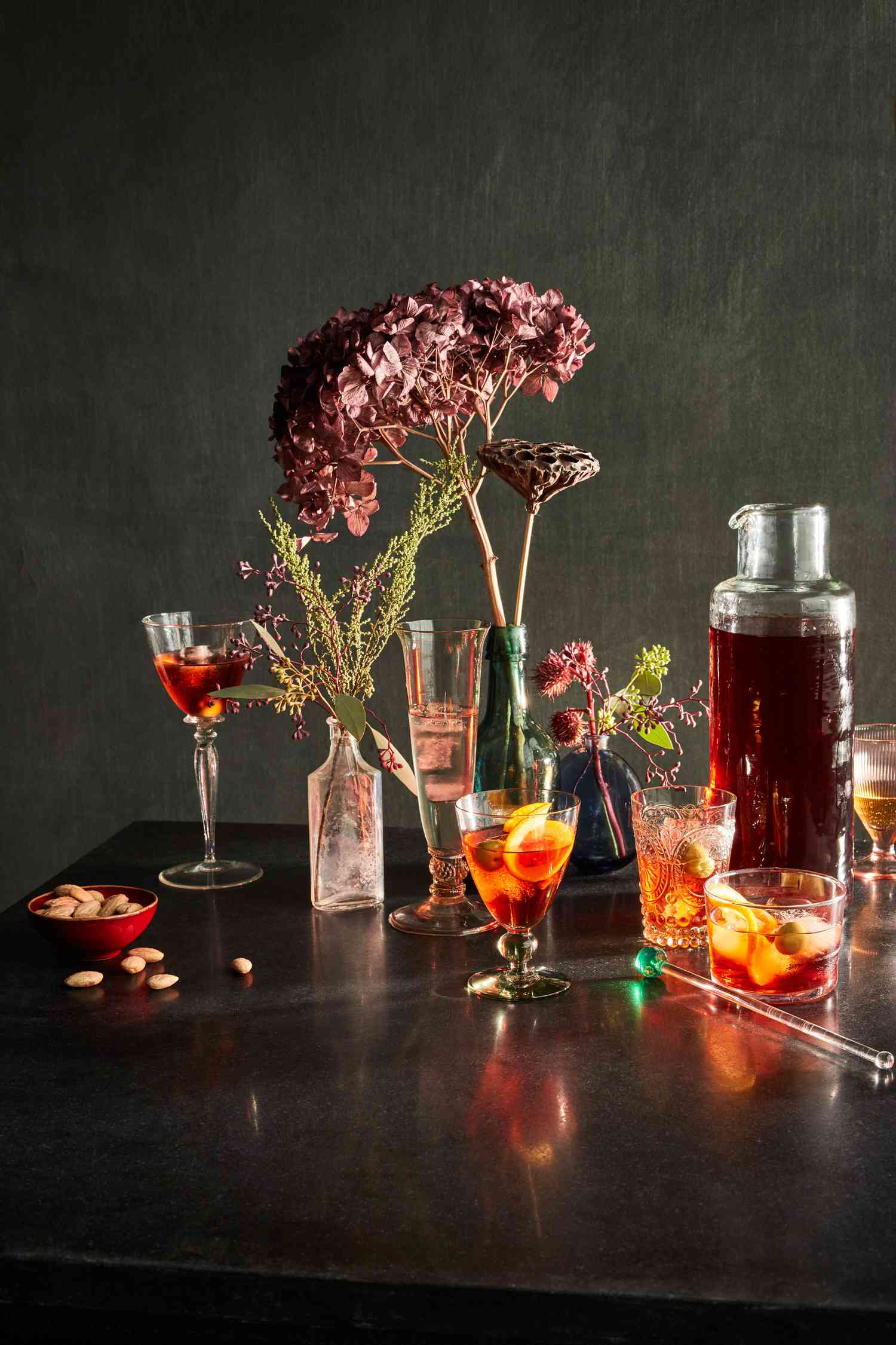 sherry and negroni cocktails and bowl of almonds