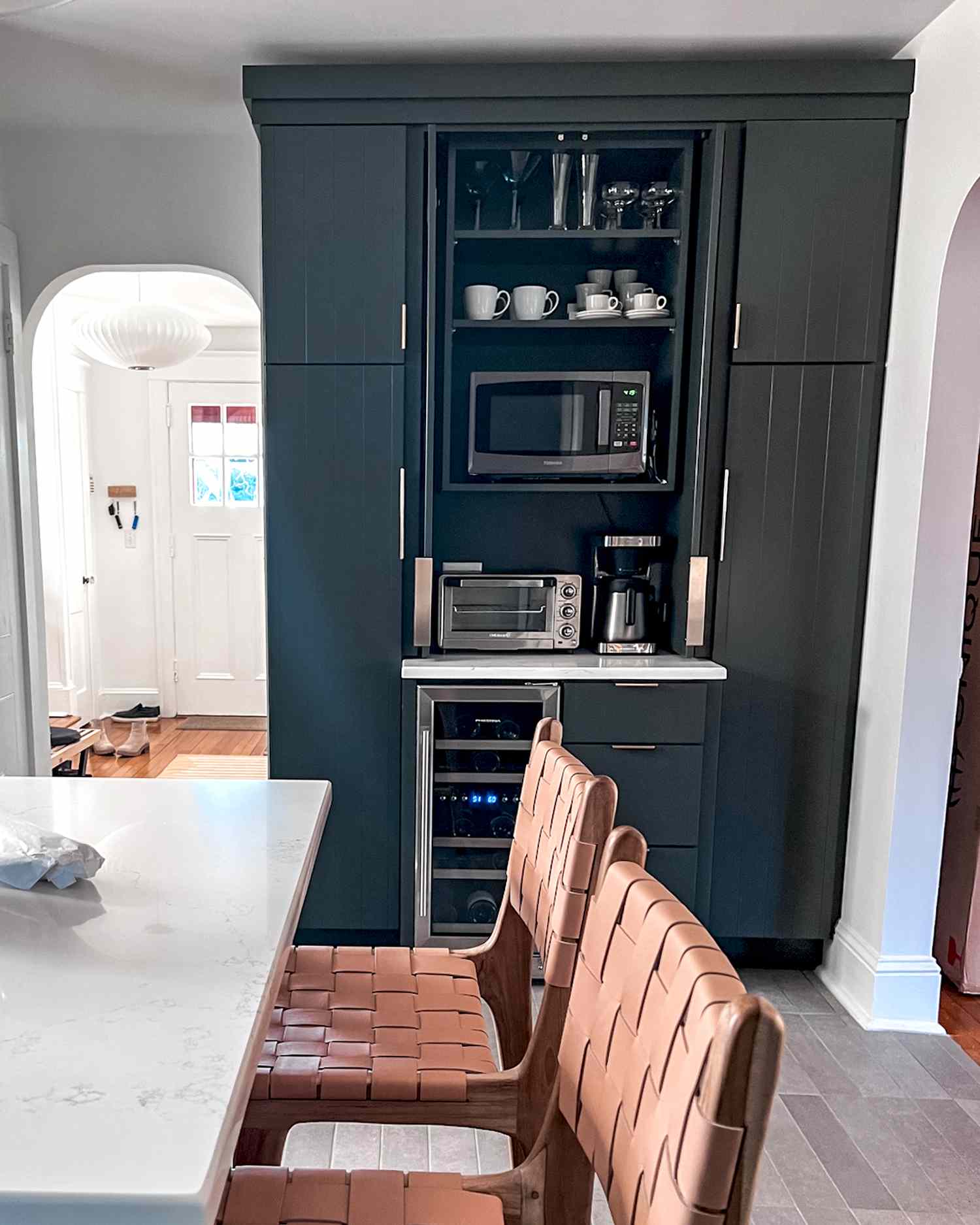 tall appliance garage with pocket door cabinets