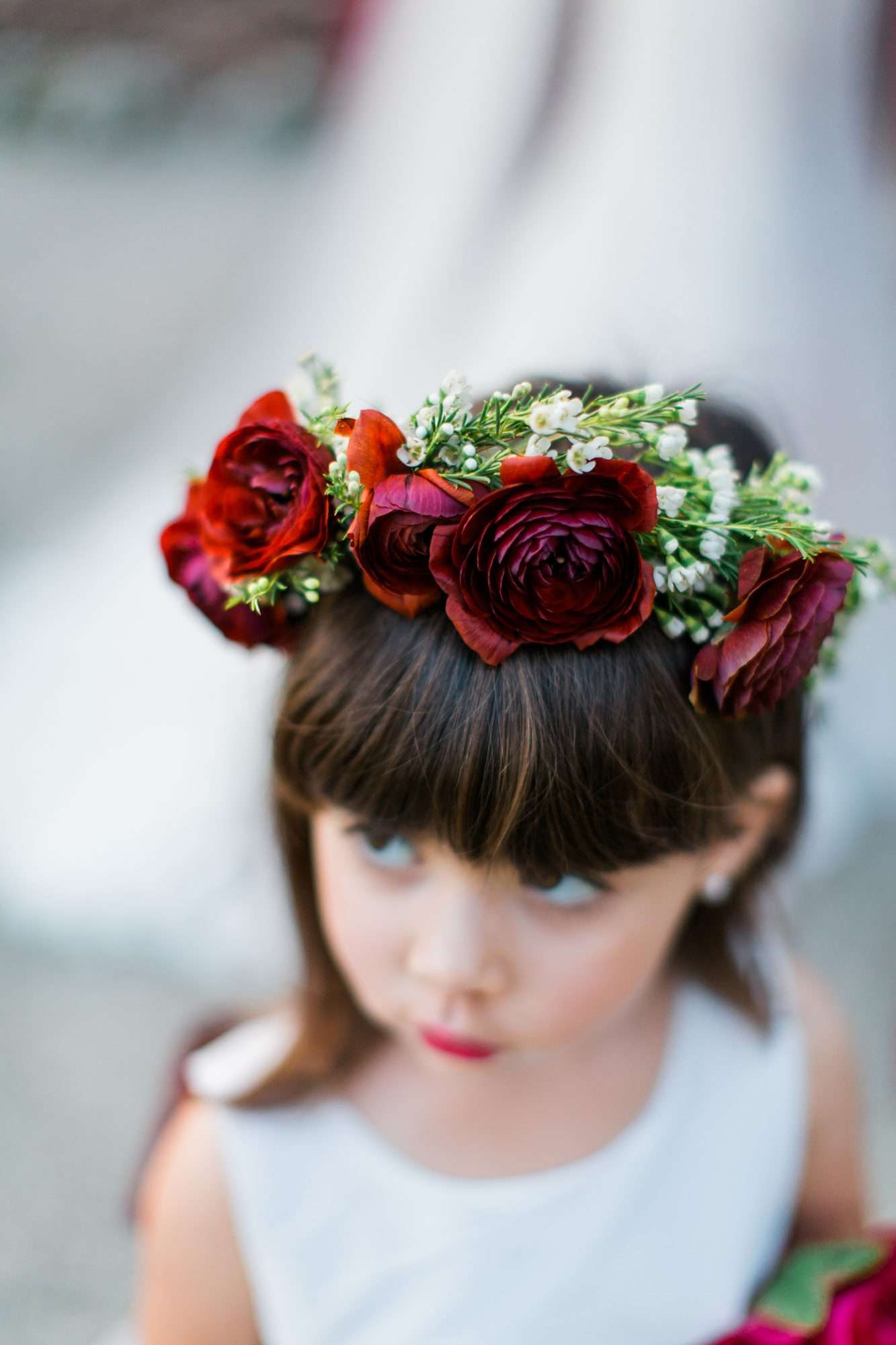 Flower Girl Bun Hairstyle Bangs and Blooms