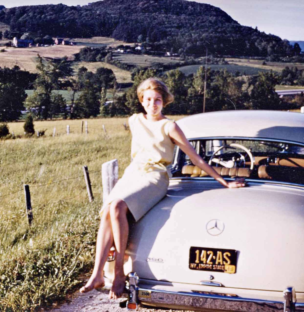 decorvow on her honeymoon beside a vintage car