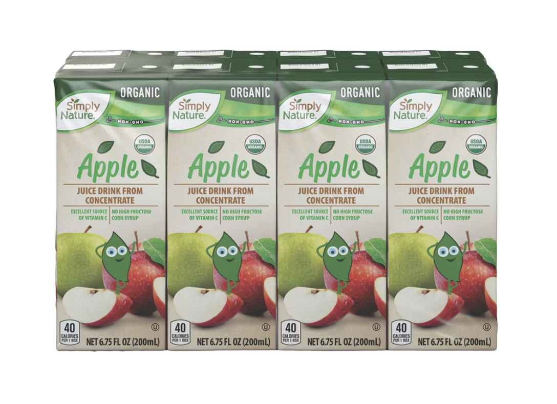 Sixpack of Simply Nature organic apple juice cartons with apples and a green character illustration on the packaging