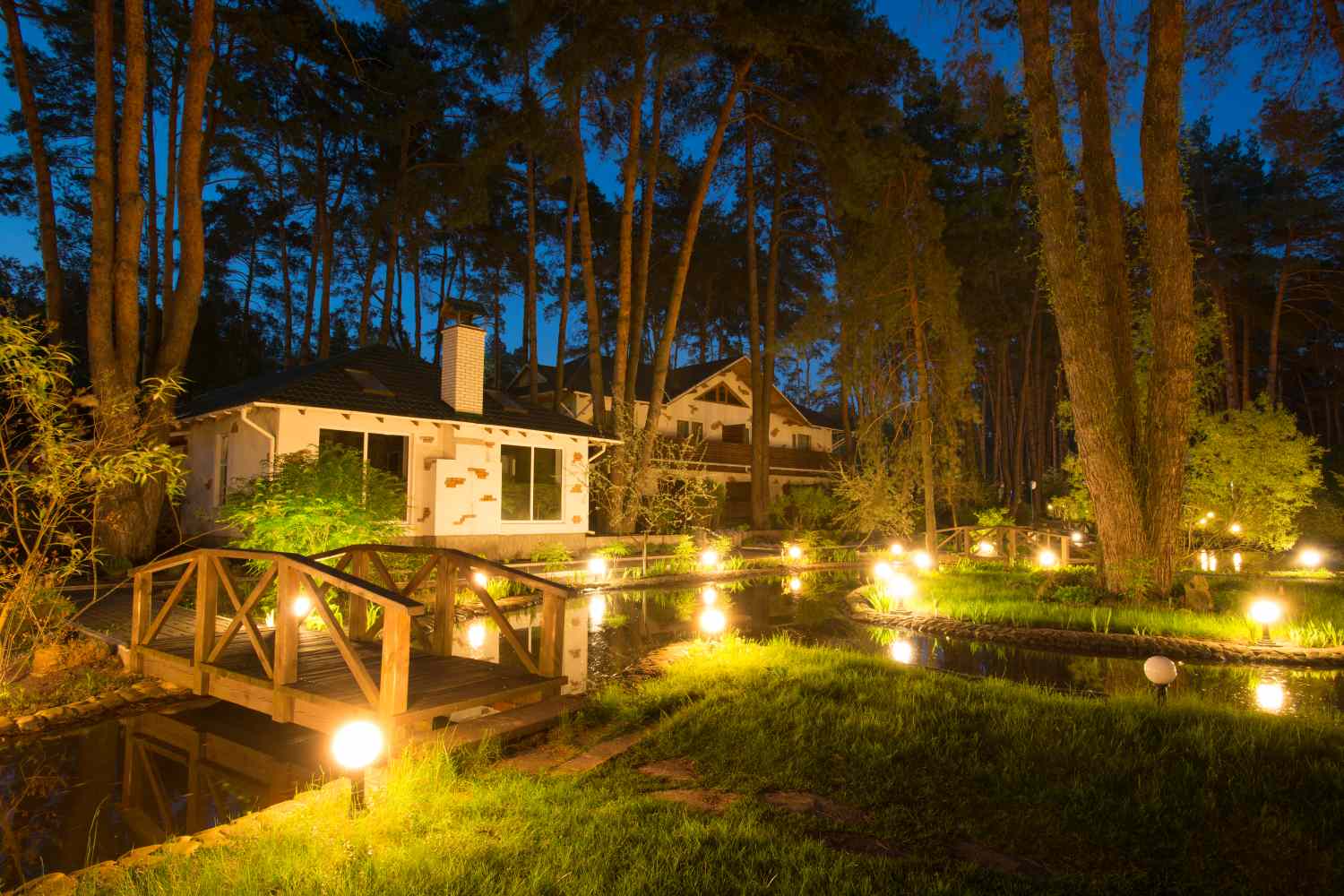 Cozy resort by the lake in the conifer forest at night