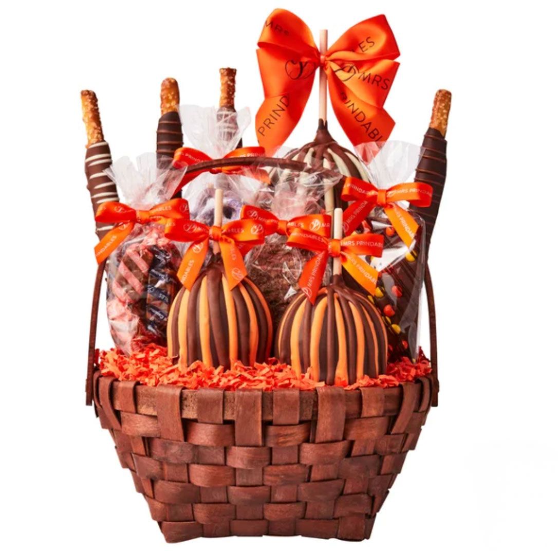 A chocolatethemed gift basket with assorted treats and ribbon decorations
