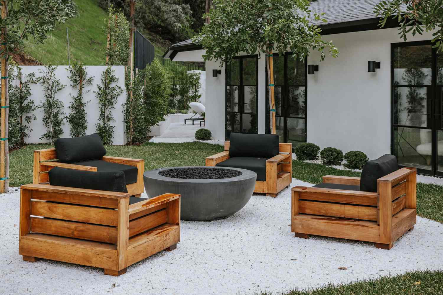 white patio area with wooden furniture
