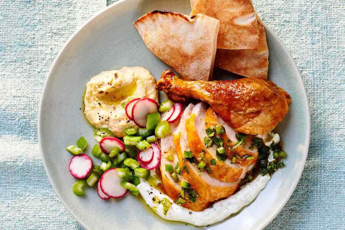 rotisserie chicken with yogurt sauce and herb relish